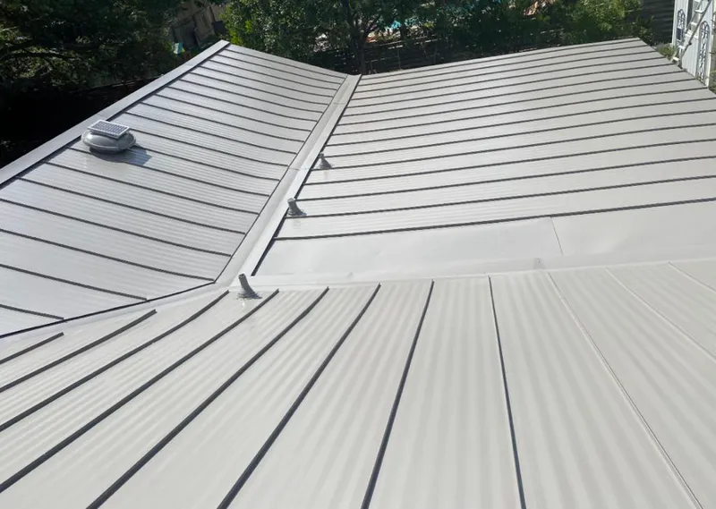 Solar attic fan installed on a metal roof for Roof Ventilation in Carlsbad
